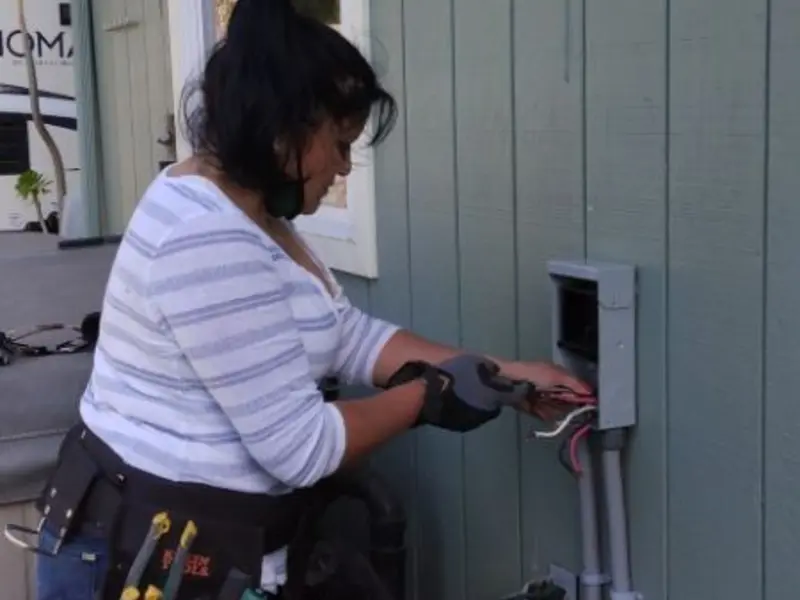 Licensed electrician wiring an exterior subpanel in Fort Washington